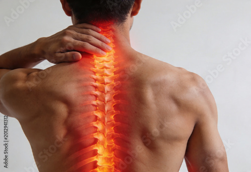 Man holding neck experiencing pain inflammation ache nerve cervical spine person health medicine backview anatomy.