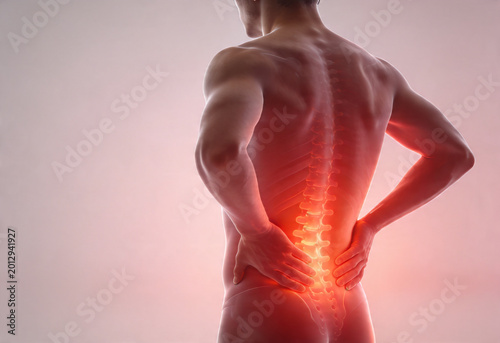 Young caucasian adult person suffering from severe lower back pain health ache bvoday anatomy nerve sciatica back inflammation medicine.