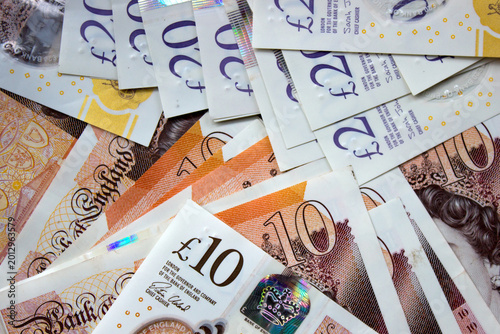 British pounds close-up on a chessboard background. National currency of Great Britain