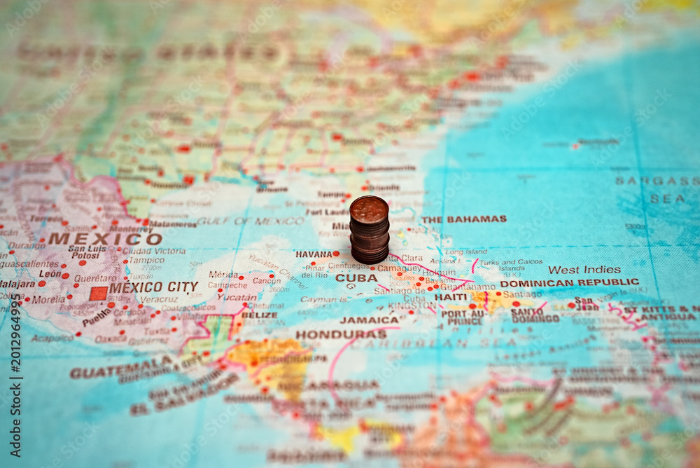 Naklejka premium Small oil barrel placed on Cuba map.