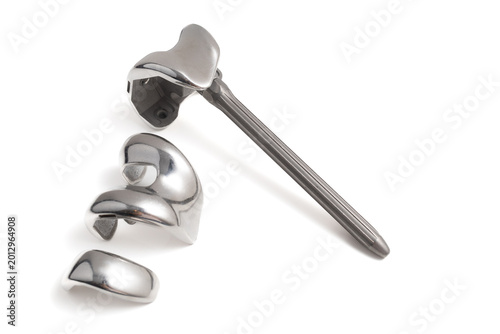 metallic knee joint prosthesis on a white background
