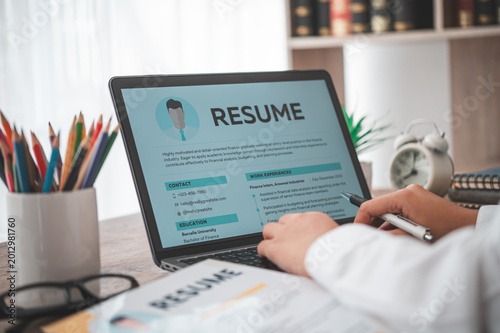 People are reviewing job applications before filling out their resume on the job application form in order 