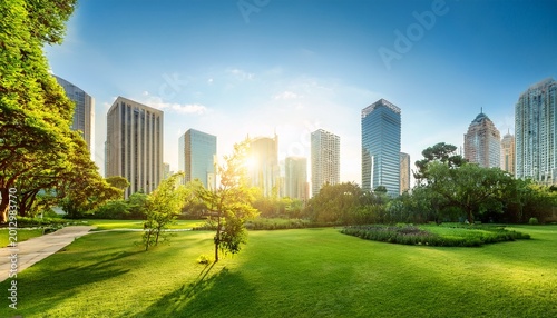 green city park with modern skyscrapers rich trees and plants surround urban buildings sun shines brightly over cityscape in late afternoon light