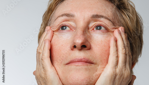 Photos Close portrait of senior woman with natural skin texture and aging beauty concept