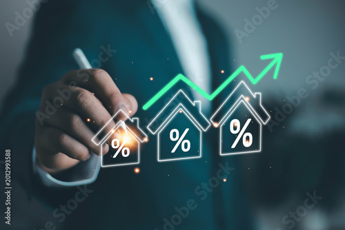Foto Businessman analyzing rising mortgage interest rates with glowing house icons and financial growth chart