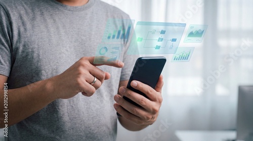Person using smartphone with floating digital analytics and charts