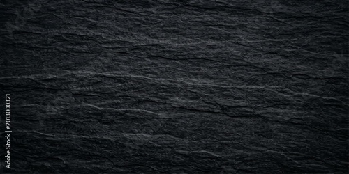 Bild auf Leinwand A dark, textured background featuring a macro surface blend of rough black leath