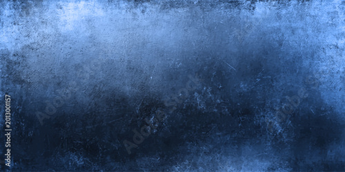 A dark aged blue grunge metal texture with a rough vintage stone pattern on a blank dirty wall backdrop for antique design backgrounds