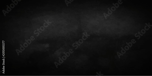 Foto A dark vintage grunge paper texture with a dirty black chalkboard effect on an o