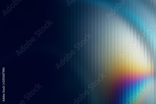 Foto Iridescent prismatic light streak over dark blue textured background