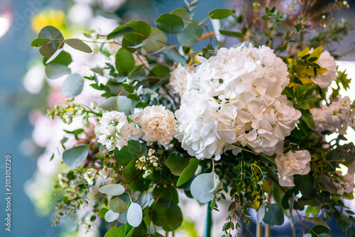 Elegant white hydrangea and greenery bouquet for wedding or birthday floral decoration on display