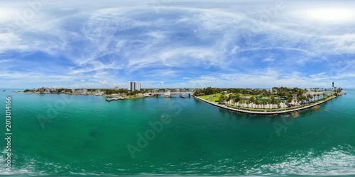 Aerial 360 VR video flying over the Hillsboro Inlet bridge with view of lighthouse 8k 2026