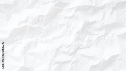 Crumpled white paper texture background with creases and folds rough and wrinkled surface
