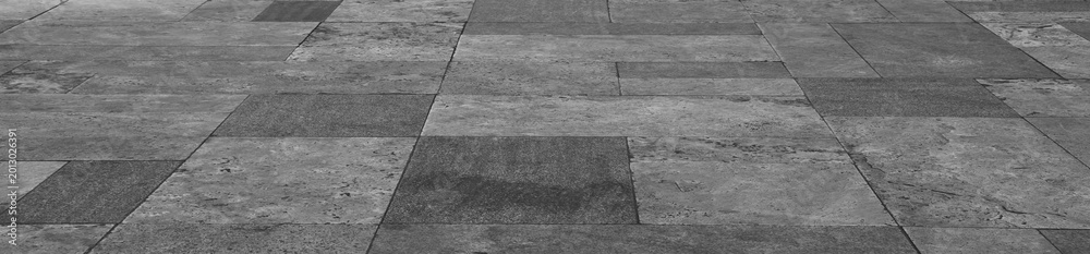 Fototapeta premium empty stone floor top in perspective. grey tile floor background in perspective view. line. empty copy space stone street. pavement. Granite outdoor tiled floor. gray granite. Marble texture
