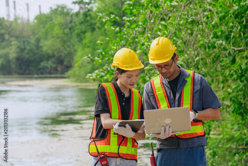Environment engineer team working survey, inspector industry impact of water river green forest