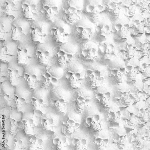 Photos A bas-relief of skulls as a background