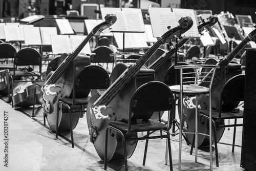 Symphony orchestra instruments on stage in black and white 