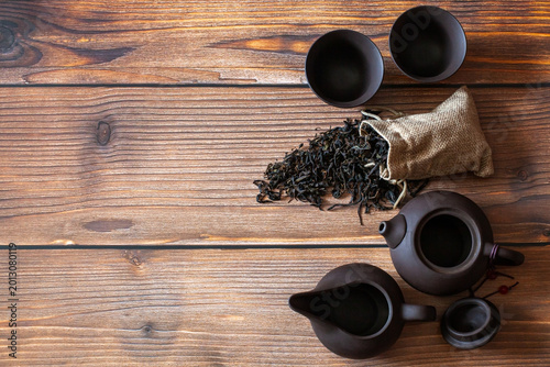 Clay tea set on wooden background