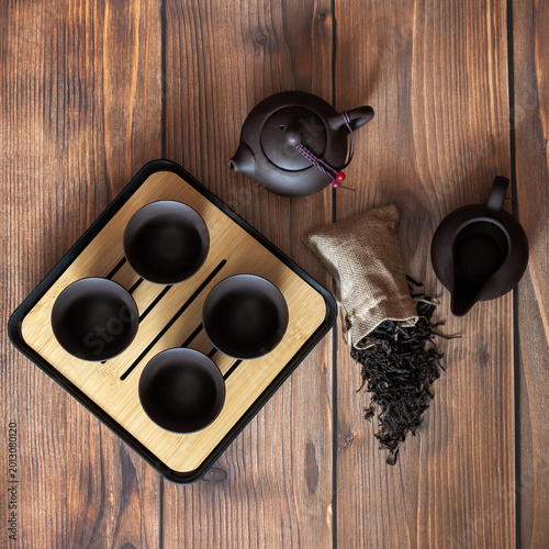  Clay tea set on wooden background