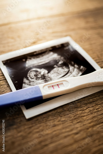 Positive pregnancy test on ultrasound photo