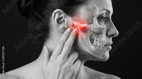 Medical concept showing highlighted jaw pain and facial anatomy in woman portrait, ideal for healthcare, dentistry and pain treatment topics.