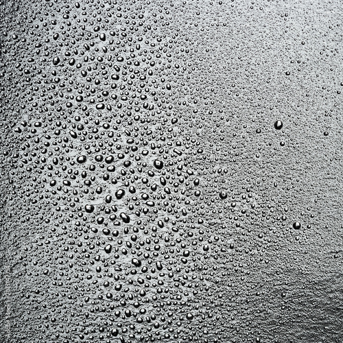 Fotografie Water droplets on a light surface. Texture of drops