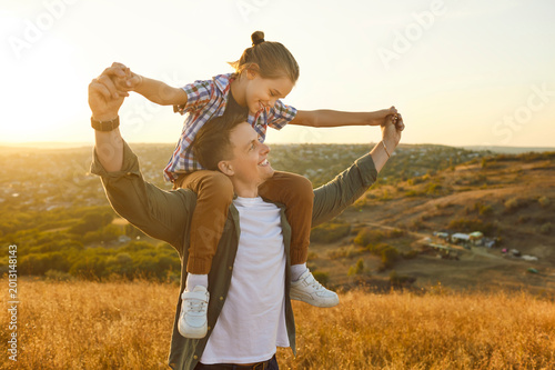 Quadro em tela Happy father and son enjoying time together at sunset