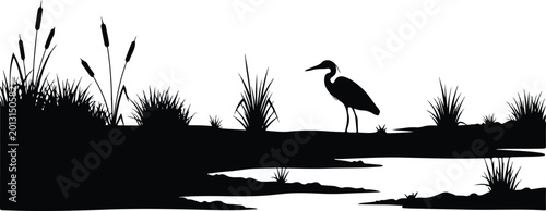 Serene Wetland Silhouette with Heron Standing by Water and Marsh Reeds