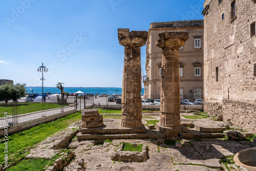 Colonne del Tempio Dorico (Temple of Poseidon or Doric Temple) with columns of Magna Graecia the modern piazza Castello in the historic centre of Taranto, Italy
