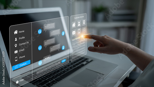 Bilde på lerret A user engages with a laptop featuring an interactive chatbot interface, showcasing modern technology in a professional setting for efficient customer support and communication