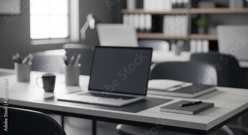 Open laptop computer sits ready for use on a modern office desk surface