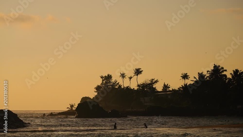 Majestic orange sky over the waves of Ahangama beach