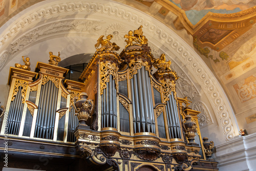 Vienna, Austria. Baroque pipe organ inside Karlskirche with ornate gold decoration