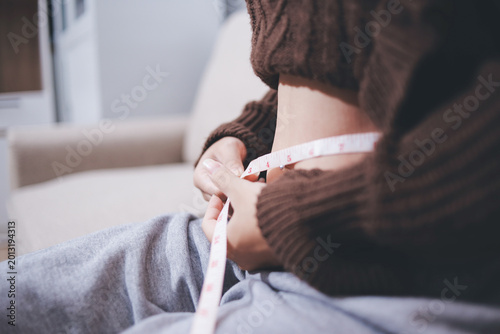 Konstfotografi fat woman, fat belly, chubby, obese woman hand holding excessive belly fat with