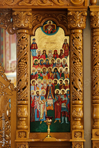 фотографія Ornate Wooden Iconostasis with Detailed Icon of All Saints in Orthodox Church