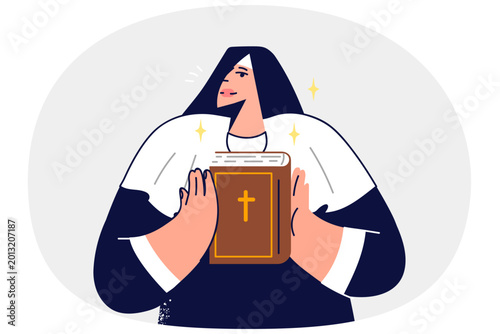 Принти на полотні Woman nun holds holy bible in hands and demonstrates main Christian book to pari