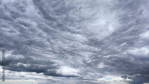 Tableau sur toile Dramatic dark storm clouds gathering in the sky, ominous weather approaching