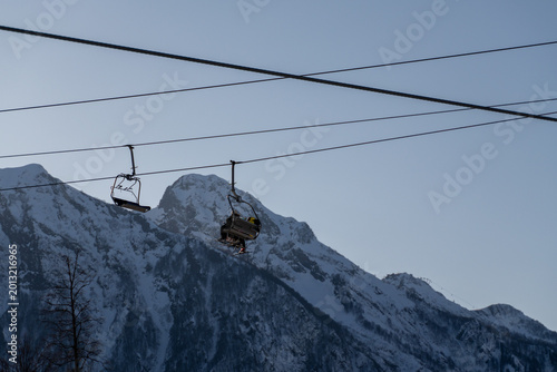 Fotografija Ski Lift Mountains Winter: Chairlifts ascend snowy peaks at dawn, showcasing alpine scenery