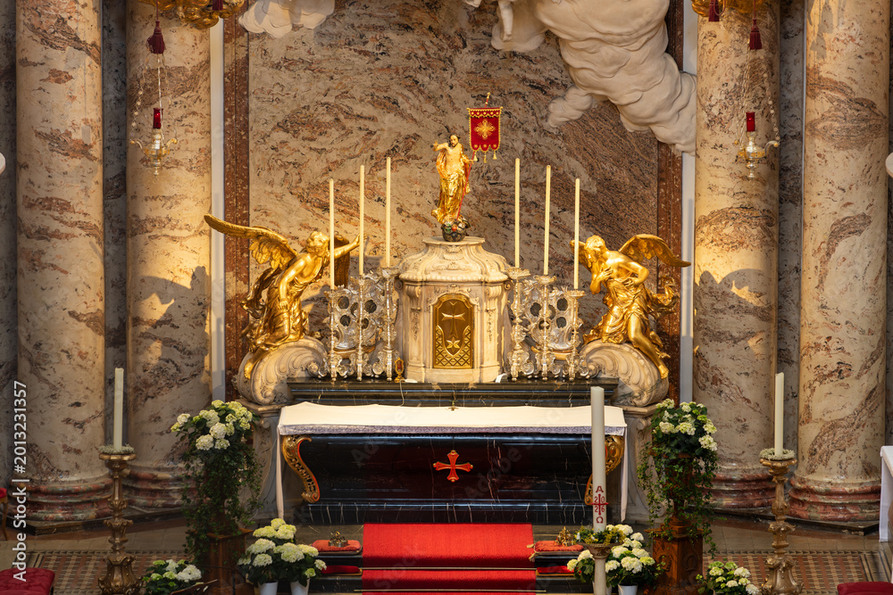 Fototapeta premium Vienna, Austria. Baroque altar with golden angels inside Karlskirche church