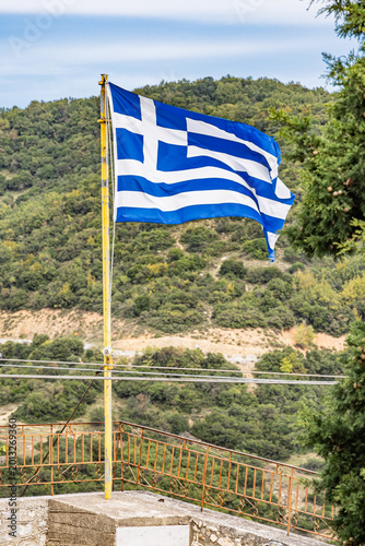 Greek flag flying in the region of Meteora.