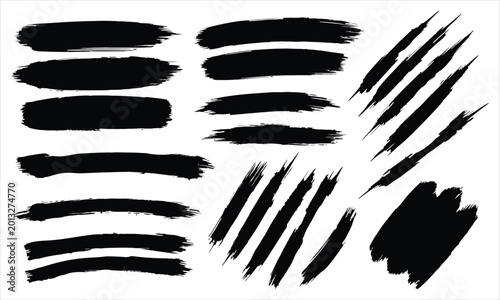 Obraz na plátně Bold abstract brush strokes and scratches on a white background for graphic desi