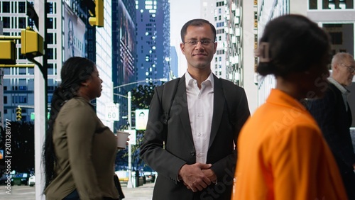 Schilderij op canvas Portrait of indian corporate worker standing on busy avenue sidewalk, multiethnic crowd of pedestrians with dynamic activity on city street
