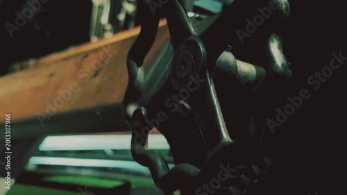 Close-up of handles and mechanisms on vintage textile machine