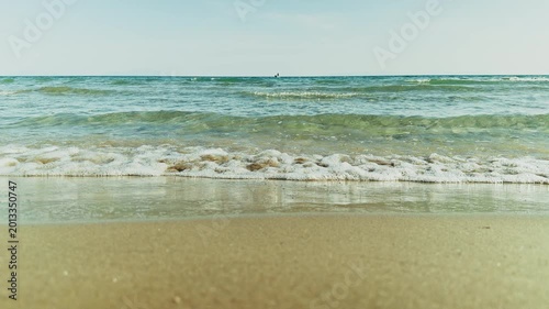 Gentle Sea Waves Crashing on Golden Sandy Beach