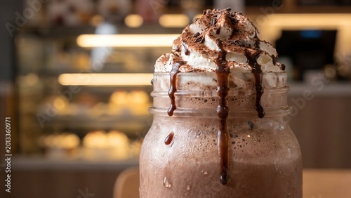 Chocolate milkshake with whipped cream and chocolate syrup
