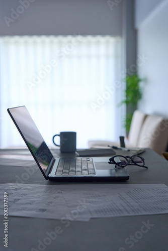 Programming code displayed on laptop screen on dark desk