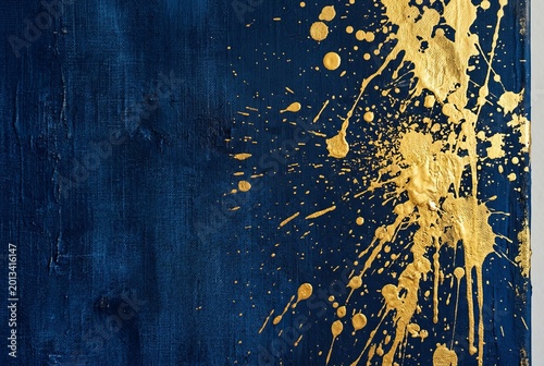 Abstract Gold Splatter on Dark Blue Textured Background.