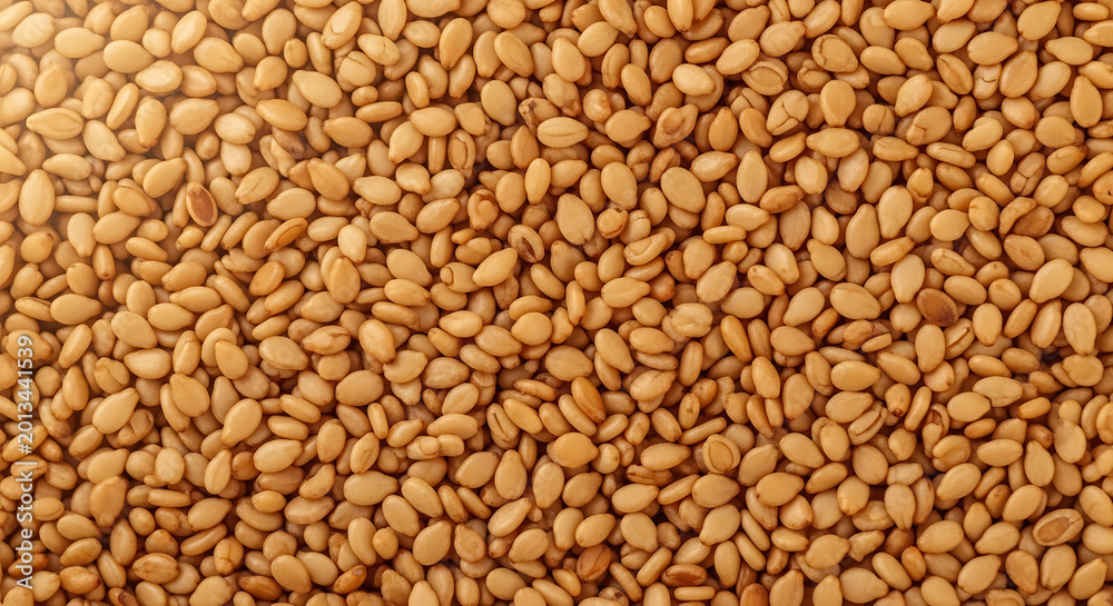 Fototapeta premium Close-up Macro Shot of Toasted Sesame Seeds, Healthy Food Ingredient Background