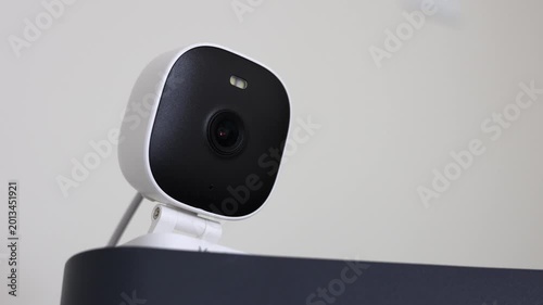 Discreet Security Camera Perched Above.