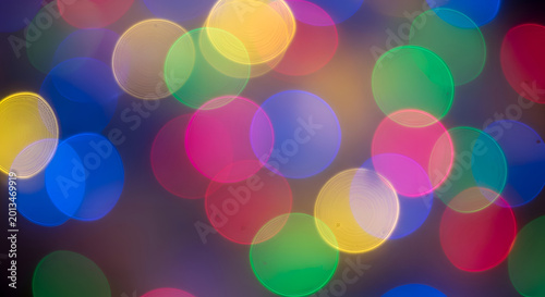 Colorful bokeh lights abstract background texture.